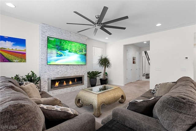8107 Skye Sweep St, Las Vegas, NV 89166 - living room with a tiled fireplace, recessed lighting, carpet, ceiling fan, and baseboards
