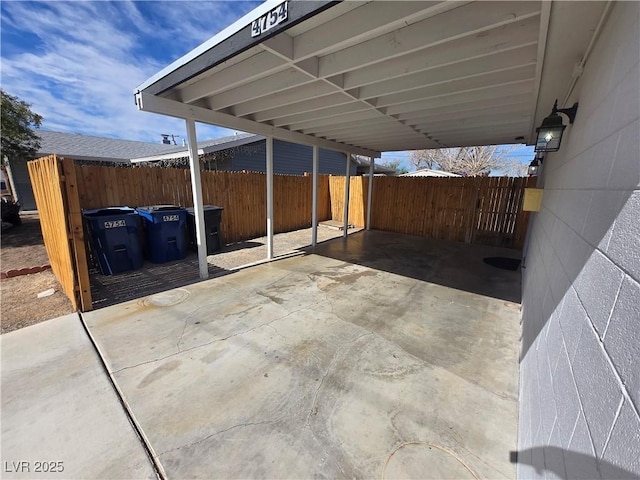 4754 Marnell Dr, Las Vegas, NV 89121 - view of patio / terrace with a carport and fence