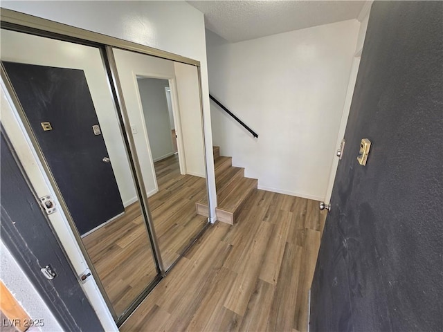 4754 Marnell Dr, Las Vegas, NV 89121 - foyer with baseboards, wood finished floors, and stairs