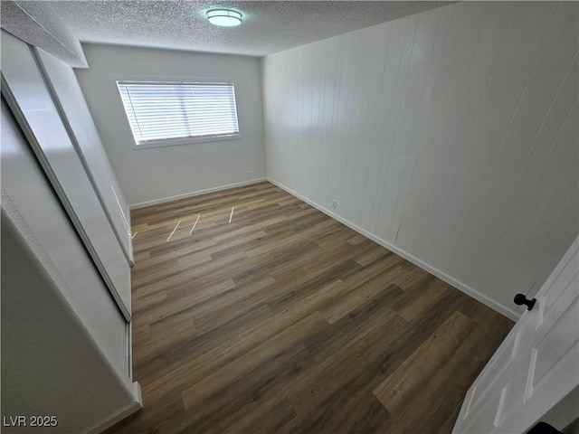 4754 Marnell Dr, Las Vegas, NV 89121 - unfurnished room featuring wood finished floors, a textured ceiling, and baseboards