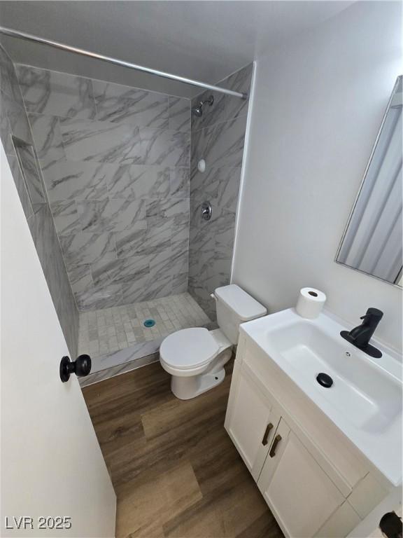 4754 Marnell Dr, Las Vegas, NV 89121 - full bathroom with toilet, wood finished floors, vanity, and a stall shower