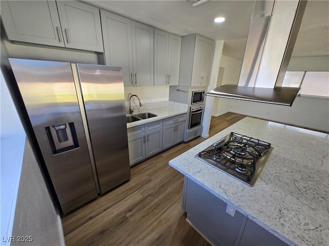 4754 Marnell Dr, Las Vegas, NV 89121 - kitchen with light stone counters, dark wood-style floors, stainless steel appliances, and a sink