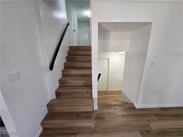 4754 Marnell Dr, Las Vegas, NV 89121 - stairs featuring baseboards and wood finished floors