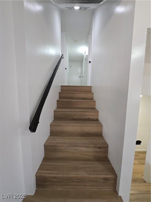 4754 Marnell Dr, Las Vegas, NV 89121 - stairs with wood finished floors and visible vents