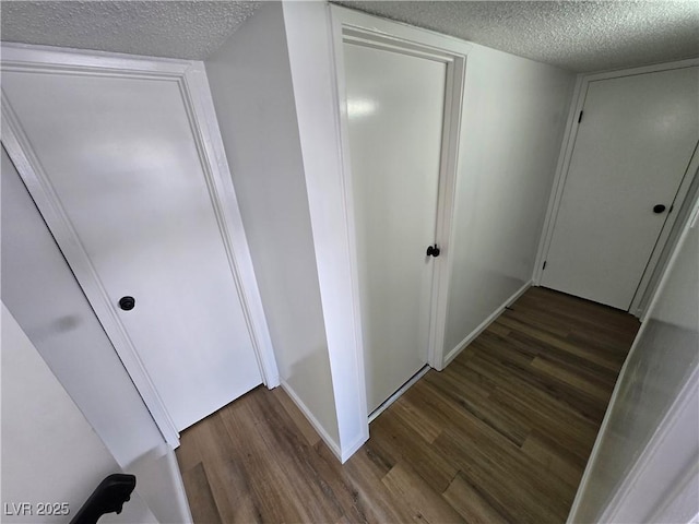 4754 Marnell Dr, Las Vegas, NV 89121 - hallway with wood finished floors, a textured ceiling, and baseboards