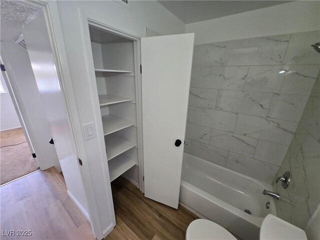 4754 Marnell Dr, Las Vegas, NV 89121 - full bathroom featuring shower / bathing tub combination, wood finished floors, and toilet
