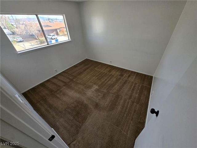 4754 Marnell Dr, Las Vegas, NV 89121 - spare room with dark colored carpet