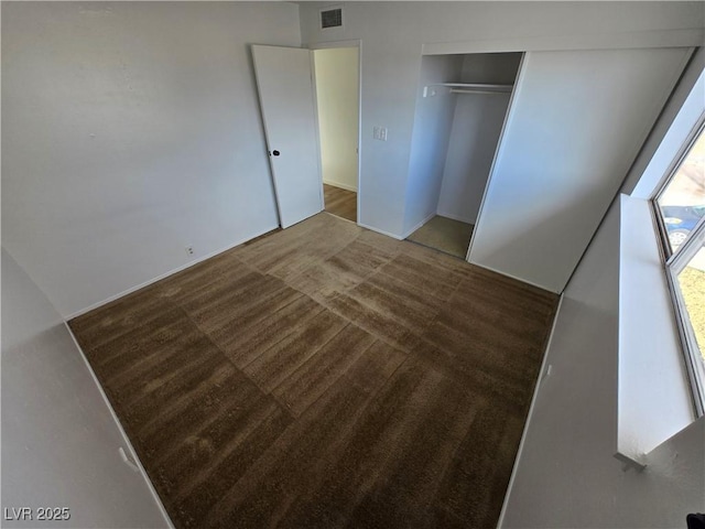 4754 Marnell Dr, Las Vegas, NV 89121 - unfurnished bedroom with carpet floors, visible vents, and a closet