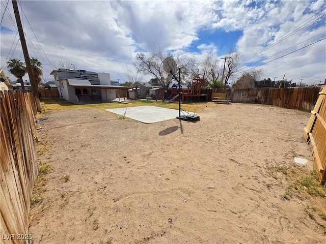 4754 Marnell Dr, Las Vegas, NV 89121 - view of yard featuring a fenced backyard and a playground