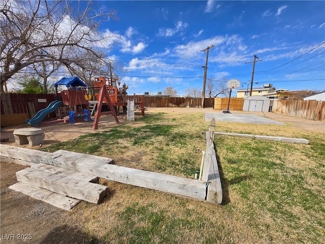 4754 Marnell Dr, Las Vegas, NV 89121 - view of yard with a fenced backyard, a storage unit, an outbuilding, and a playground