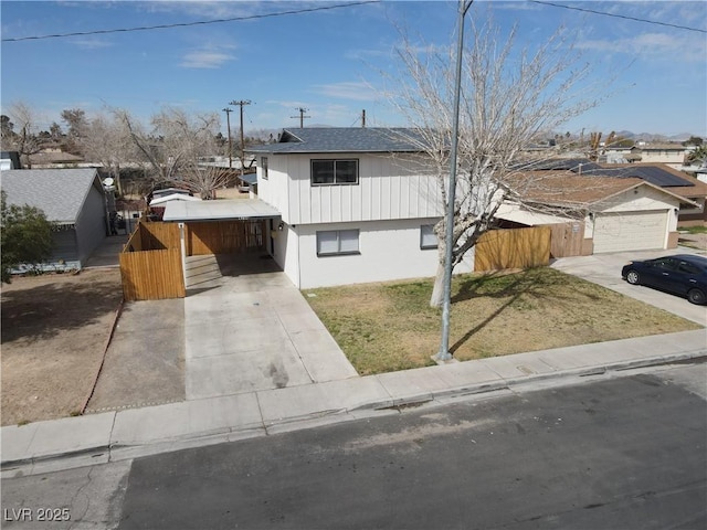 4754 Marnell Dr, Las Vegas, NV 89121 - view of front of house featuring fence, a front lawn, driveway, and a residential view