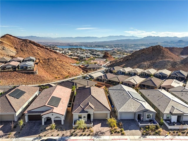 aerial view featuring a residential view and a water and mountain view