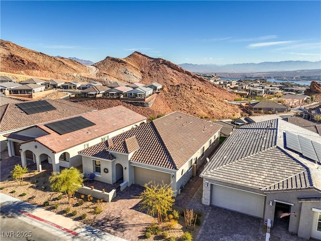 drone / aerial view with a mountain view and a residential view