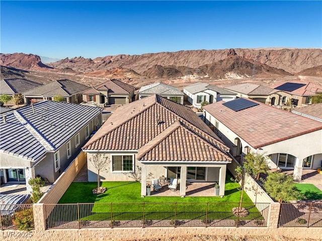 aerial view featuring a mountain view and a residential view