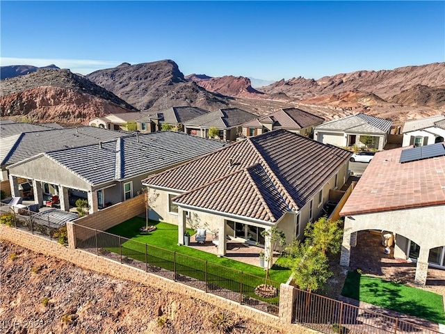 aerial view featuring a mountain view and a residential view