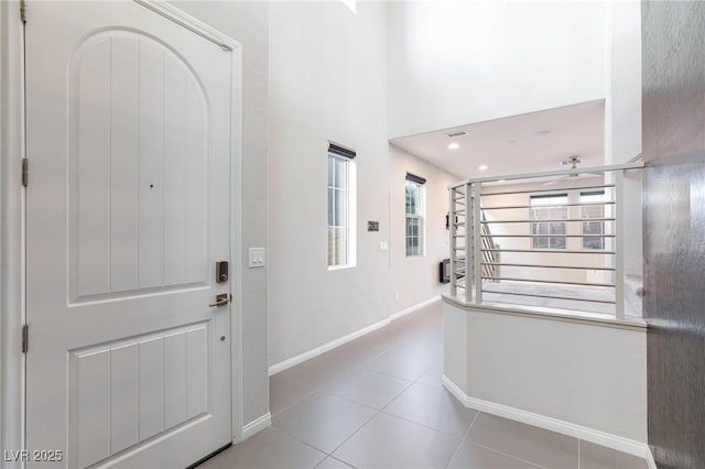 26 Lilla Rosa St, Henderson, NV 89011 - entrance foyer with baseboards, a high ceiling, and tile patterned flooring