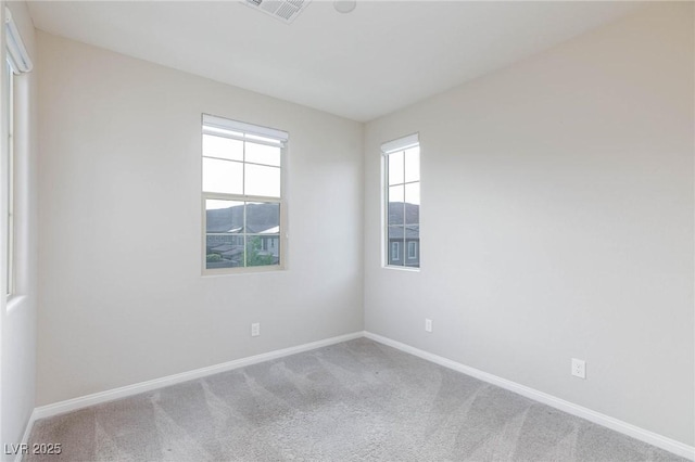 26 Lilla Rosa St, Henderson, NV 89011 - carpeted spare room with baseboards and visible vents