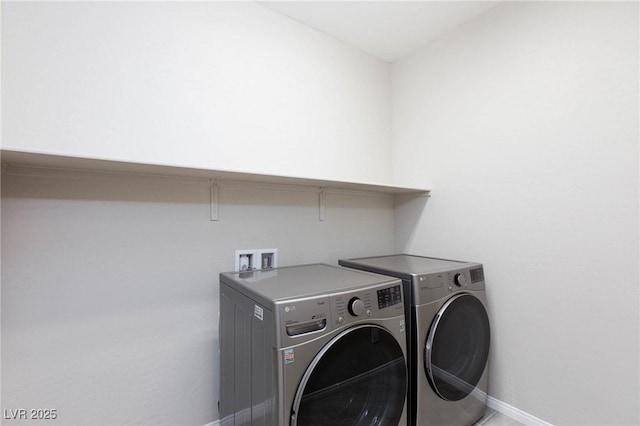 26 Lilla Rosa St, Henderson, NV 89011 - laundry room featuring washer and clothes dryer, baseboards, and laundry area