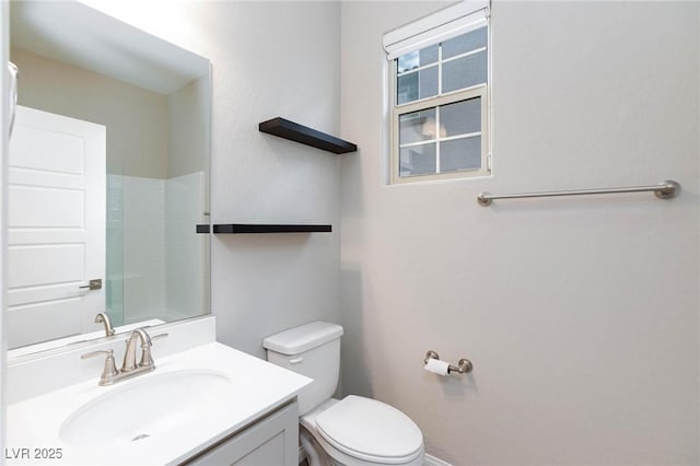 26 Lilla Rosa St, Henderson, NV 89011 - full bathroom with vanity, toilet, and baseboards