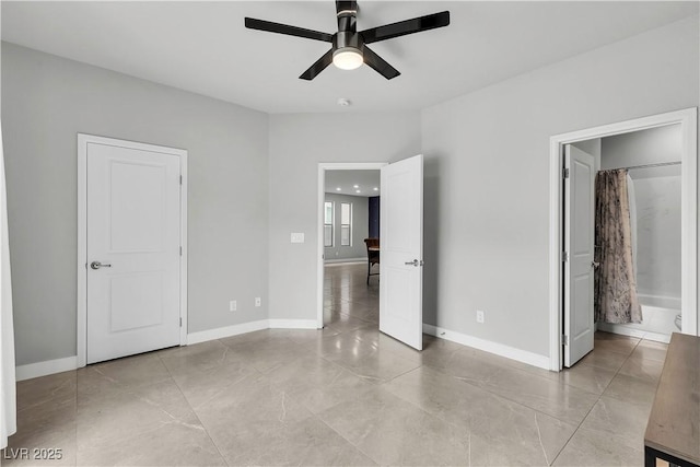 unfurnished bedroom featuring baseboards, light tile patterned floors, and ceiling fan