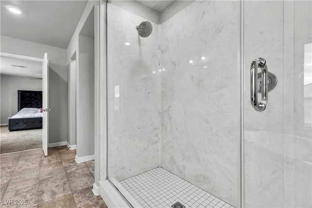 ensuite bathroom featuring ensuite bathroom, a marble finish shower, baseboards, and visible vents