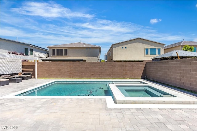 view of pool with a patio, a fenced backyard, and a pool with connected hot tub