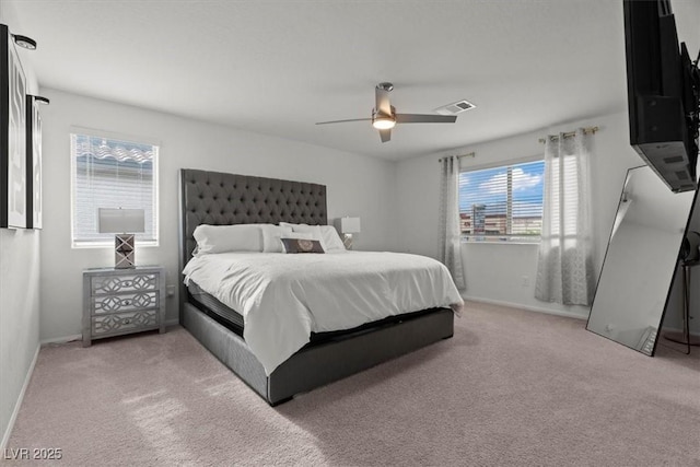 bedroom with baseboards, a ceiling fan, visible vents, and carpet