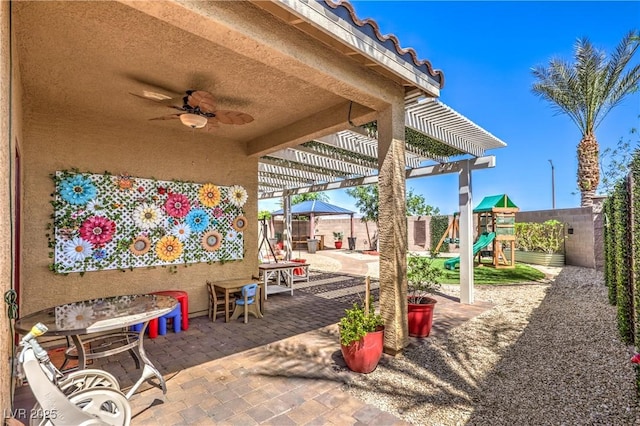 view of patio with a pergola, a fenced backyard, ceiling fan, and a playground