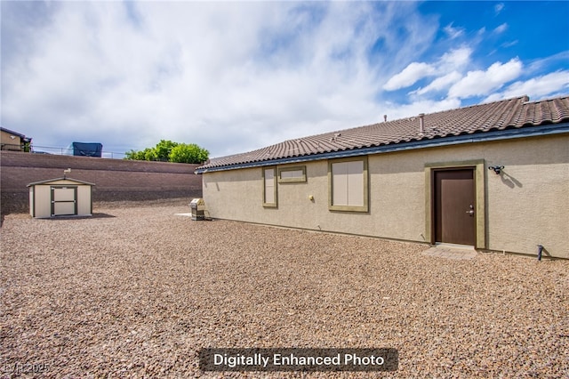10470 Irish Cliffs Ct, Las Vegas, NV 89149 - view of property exterior with stucco siding, a storage unit, a tiled roof, and an outbuilding