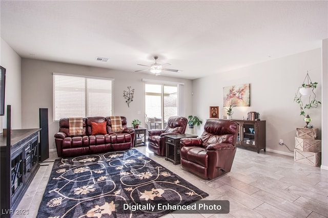 10470 Irish Cliffs Ct, Las Vegas, NV 89149 - living area with visible vents, a ceiling fan, and baseboards