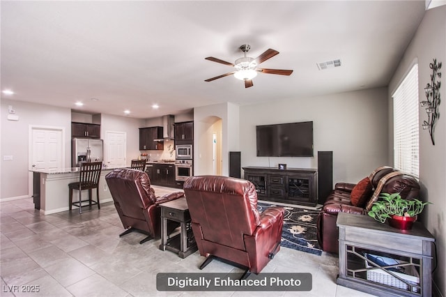 10470 Irish Cliffs Ct, Las Vegas, NV 89149 - living area featuring recessed lighting, arched walkways, light tile patterned floors, visible vents, and a ceiling fan