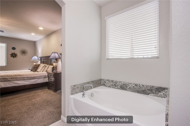 10470 Irish Cliffs Ct, Las Vegas, NV 89149 - ensuite bathroom featuring a healthy amount of sunlight, connected bathroom, recessed lighting, and a bath