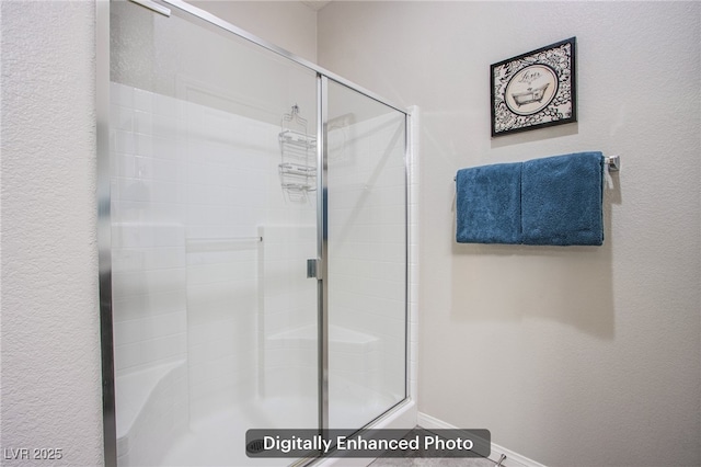 10470 Irish Cliffs Ct, Las Vegas, NV 89149 - full bathroom featuring baseboards, a shower stall, and a textured wall