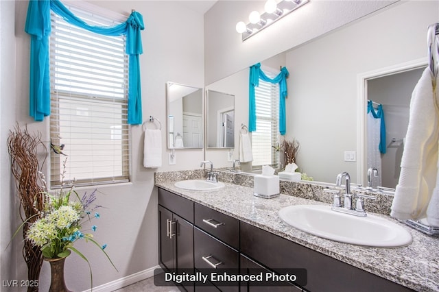 10470 Irish Cliffs Ct, Las Vegas, NV 89149 - bathroom with double vanity, baseboards, and a sink