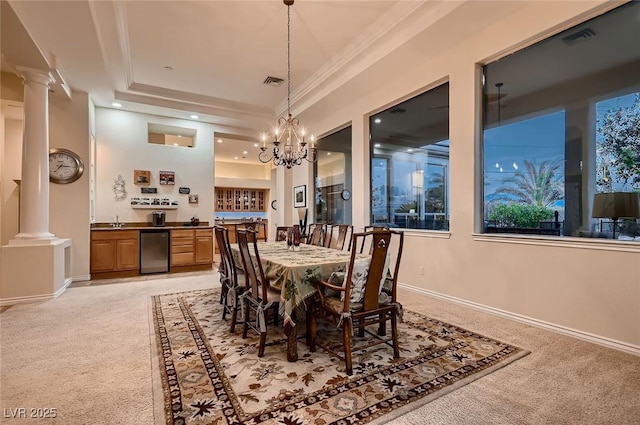 dining area with visible vents, ornate columns, and light colored carpet
