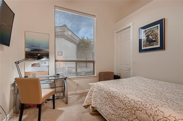 bedroom featuring carpet flooring and baseboards
