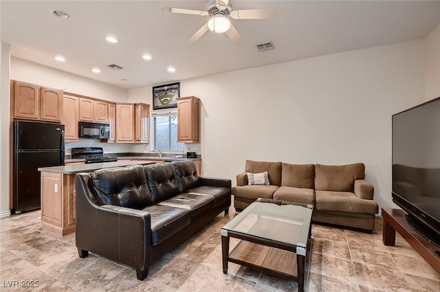 living room featuring visible vents, a ceiling fan, and recessed lighting
