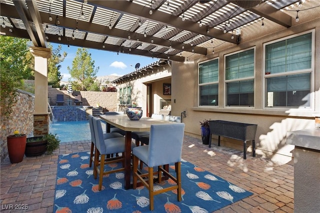 view of patio with a pergola, outdoor dining space, and fence