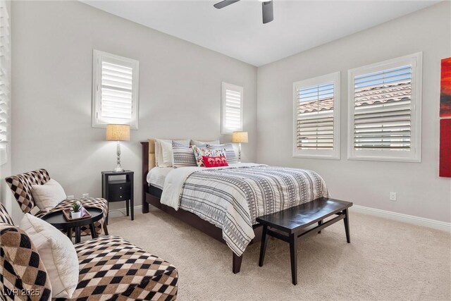 bedroom featuring a ceiling fan, baseboards, and light colored carpet
