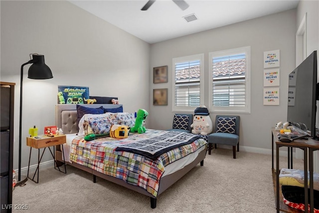 carpeted bedroom with ceiling fan, baseboards, and visible vents