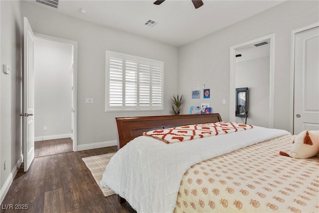 bedroom with visible vents, baseboards, wood finished floors, and ceiling fan