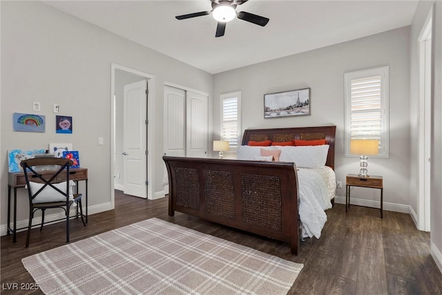 bedroom featuring wood finished floors, a closet, baseboards, and ceiling fan