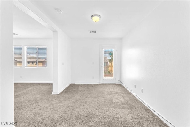 5060 Blue Rose St, North Las Vegas, NV 89081 - spare room featuring baseboards, visible vents, and carpet