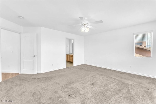 5060 Blue Rose St, North Las Vegas, NV 89081 - empty room featuring carpet floors, a ceiling fan, and baseboards