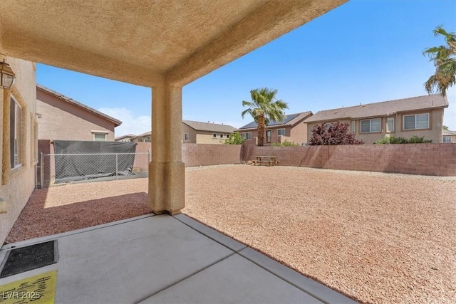 5060 Blue Rose St, North Las Vegas, NV 89081 - view of patio / terrace with a residential view and a fenced backyard