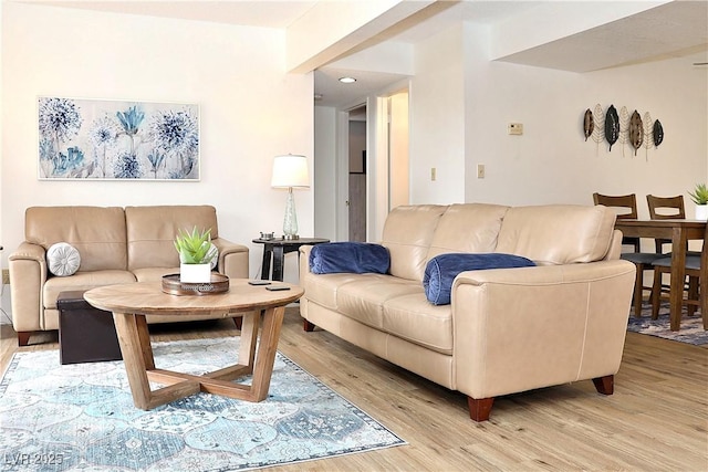 living room with recessed lighting and light wood-type flooring
