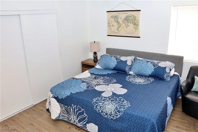 bedroom with wood finished floors