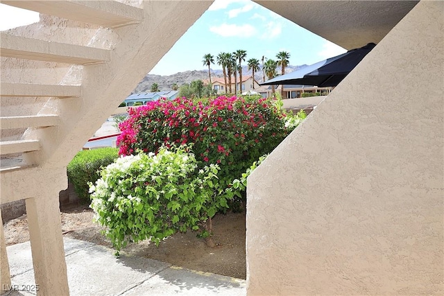 details featuring stucco siding and a mountain view