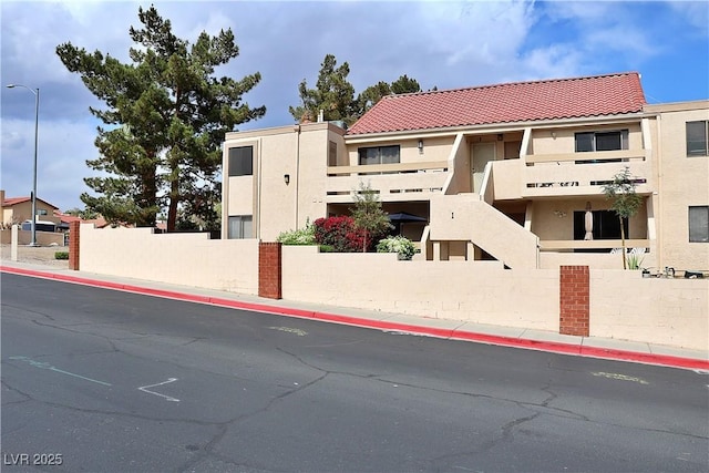 view of building exterior featuring fence