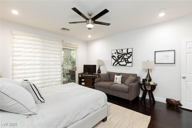 bedroom with recessed lighting, wood finished floors, visible vents, and baseboards